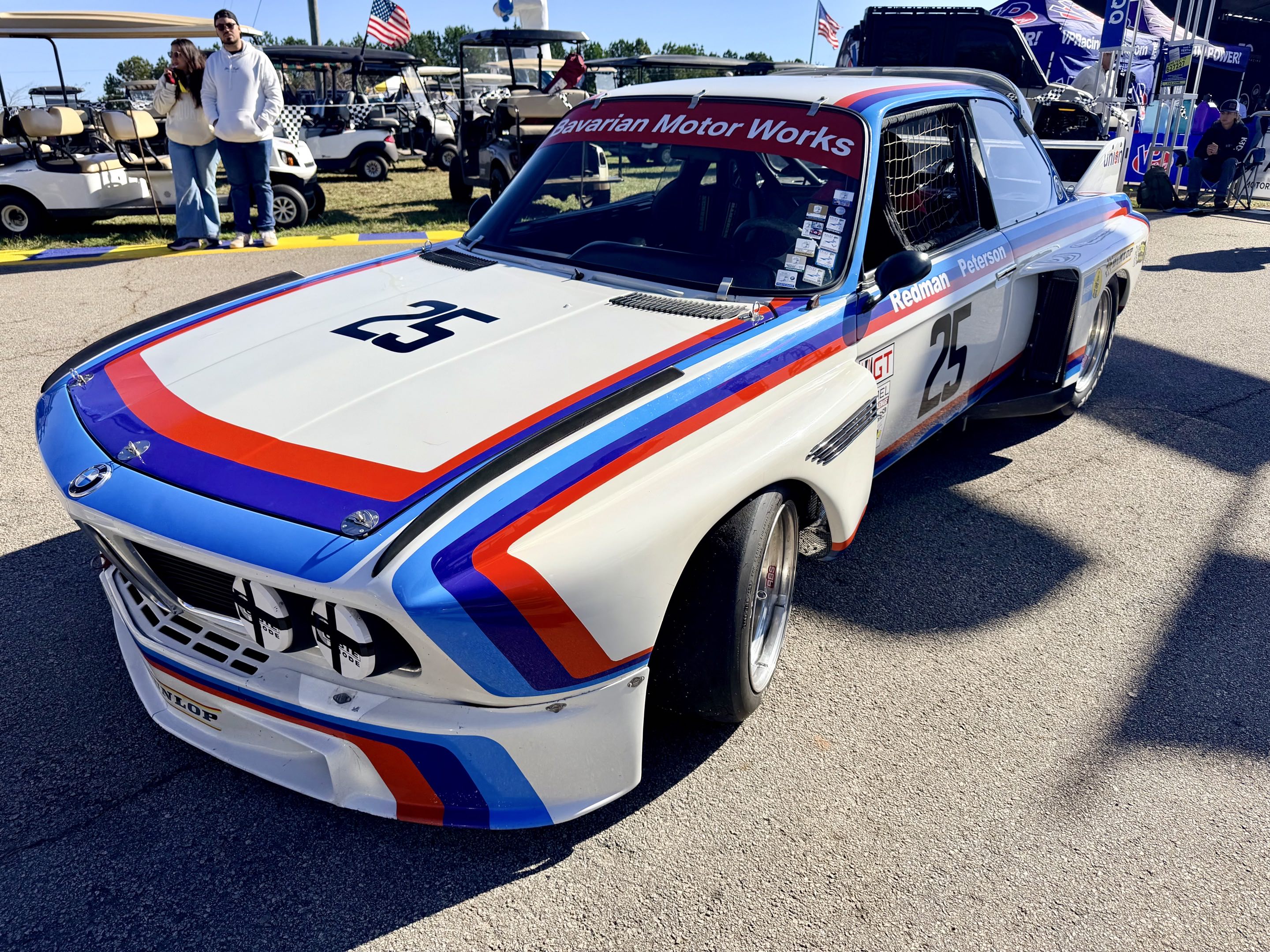 A BMW 3.0 CSL Group 4 parked in a fan area